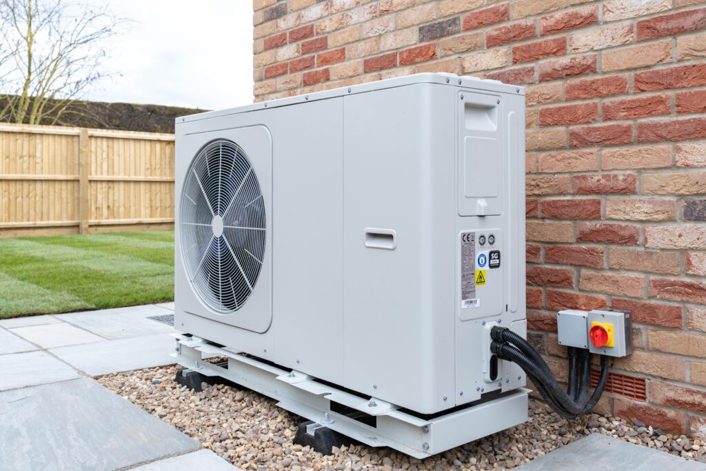 A modern heat pump installed outdoors provides efficient heating and cooling for your home with energy savings and reliable performance.